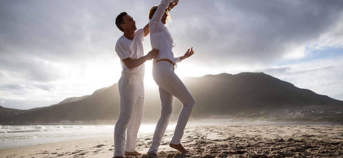 Mature couple having fun together at beach