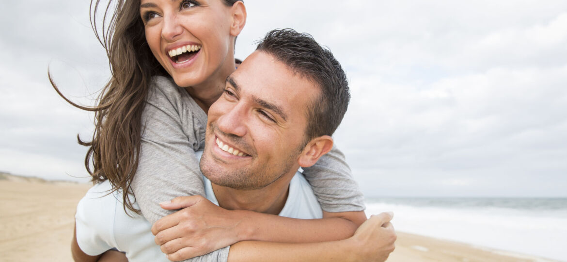 portrait of living young couple at the beach